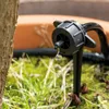 A close-up of a drip irrigation emitter with a water drop falling. Produktbild-Vorschau