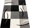 A modern rug with a checkered pattern and abstract curved lines. Anteprima dell’immagine prodotto
