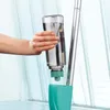 A hand is shown inserting a water tank into a spray mop. Anteprima dell’immagine prodotto