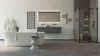 A modern bathroom with a freestanding bathtub, a vanity with a mirror, and a glass-enclosed shower. Podgląd zdjęcia produktu