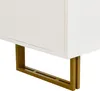 A close-up view of the bottom corner of a white sideboard, showing its gold-colored metal legs. Produktbild-Vorschau