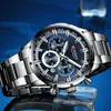 A close-up shot of a men's wristwatch with a blue dial and silver metal band, resting on a reflective surface with blue lighting. Produktbild-Vorschau