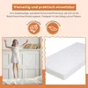 A young girl jumping on a bed next to a mattress. Produktbild-Vorschau