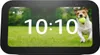 A smart display showing the time, weather, and a picture of a dog playing with a ball. Anteprima dell’immagine prodotto