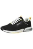 A studio shot of a black sneaker with white laces and yellow accents. Voir les images du produit