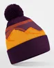 A knitted beanie with a pom pom on top, displayed against a plain background. Anteprima dell’immagine prodotto
