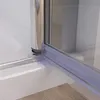 Close-up view of a shower door seal and frame. Produktbild-Vorschau