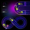 Two different race tracks with remote-controlled cars, one a U-turn and the other an infinity loop, with neon lighting. Voir les images du produit