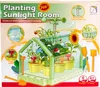 A colorful illustration of a children's planting kit, showing a miniature greenhouse with plants, bees, and gardening tools. Podgląd zdjęcia produktu