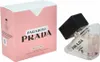 A pink box and a clear perfume bottle with a black cap are shown against a white background. Produktbild-Vorschau