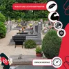A cemetery scene with a black metal bench in the foreground, surrounded by gravestones and greenery. Overlay graphics highlight product features. Produktbild-Vorschau