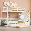 A white bunk bed with a pull-out trundle bed and storage drawers, set in a bedroom with peach-colored walls and decorative hexagonal wall art. Anteprima dell’immagine prodotto