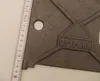 A close-up of a metal grate with a ruler next to it. Anteprima dell’immagine prodotto