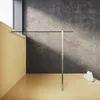 A modern bathroom shower wall with a glass panel and a metal support. Produktbild-Vorschau