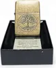 A Zippo lighter with a tree of life design sits in its box with informational text. Náhľad obrázku produktu