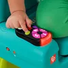 A baby's hand is pressing buttons on a toy remote control that is part of a larger toy. Anteprima dell’immagine prodotto