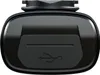 A close-up view of a black bicycle light with a USB symbol embossed on it. Produktbild-Vorschau