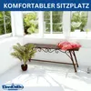 A metal garden bench with a pillow and a plant in a sunlit room with large windows. Anteprima dell’immagine prodotto