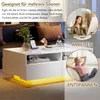 A split image showing a white coffee table with LED lighting and two circular insets. One inset shows a woman working on a laptop at a desk, labeled 'ARBEITEN' (Work). The other inset shows a woman relaxing on a couch, labeled 'ENTSPANNEN' (Relax). Náhled obrázku produktu