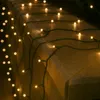 A string of lights draped over a textured surface. Náhled obrázku produktu
