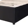 Close-up of the side and corner of a black upholstered bed frame with wooden slats. Anteprima dell’immagine prodotto