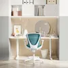 A teal and white ergonomic office chair is placed in front of a white desk with various decorative items and books on shelves above. Náhled obrázku produktu