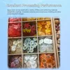 A grid of compartments filled with various colorful decorative items, possibly for resin art or crafts. Voir les images du produit