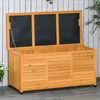 An open wooden storage box with a white fence and green foliage in the background. Produktbild-Vorschau