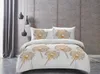 A bedroom scene with a bed dressed in dandelion-themed bedding. Podgląd zdjęcia produktu