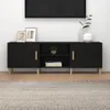 A black TV stand with wooden legs and handles, placed against a white wall. Náhled obrázku produktu