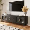 A modern living room scene featuring a black TV stand with a large television mounted above it. Anteprima dell’immagine prodotto