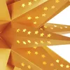 A close-up view of a golden paper star lantern with cut-out star shapes. Anteprima dell’immagine prodotto