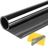 A roll of dark window tint film with a yellow squeegee and a metal cutting tool. Anteprima dell’immagine prodotto