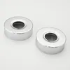 Two silver, circular objects with a hole in the center, presented on a white background. Produktbild-Vorschau