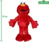 A plush toy of Elmo from Sesame Street is shown standing against a white background. A green ruler indicating 37cm is on the left side of the image, and a Sesame Street logo is in the top right corner. Produktbild-Vorschau