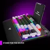 A gaming keyboard with a smartphone stand, showcasing RGB lighting. Produktbild-Vorschau