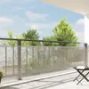 A balcony with a railing and a privacy screen. Podgląd zdjęcia produktu