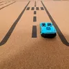 A toy car on a playmat with road markings. Produktbild-Vorschau