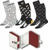 A set of Harry Potter themed socks and a presentation box. Podgląd zdjęcia produktu