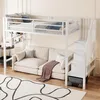 A white metal loft bed with a sofa underneath, a rug, and some decorative items. Anteprima dell’immagine prodotto