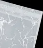 A close-up view of a white fabric curtain with a silver marble pattern. Produktbild-Vorschau