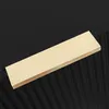 A close-up, angled view of a light-colored wooden plank resting on a black, ribbed surface. Podgląd zdjęcia produktu
