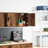 A garage or workshop setting with wall-mounted cabinets and shelving. Podgląd zdjęcia produktu