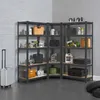 A corner shelving unit filled with various tools and storage containers, set against a brick wall and concrete floor. Podgląd zdjęcia produktu