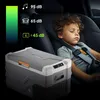 A young boy sleeps in a car seat next to a portable cooler. A graphic on the left shows noise levels associated with music, cars, and the cooler. Náhled obrázku produktu