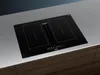 A black induction cooktop with an integrated downdraft ventilation system is shown on a countertop. Produktbild-Vorschau