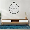 A modern living room setup with a wall clock and a TV stand. Náhľad obrázku produktu