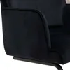 Close-up view of the armrest and base of a dark blue velvet chair. Produktbild-Vorschau
