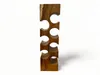 A wooden wine rack with multiple circular openings for bottles, set against a white background. Náhled obrázku produktu