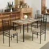 A dining set with a table and chairs in a room with a brick fireplace. Náhled obrázku produktu